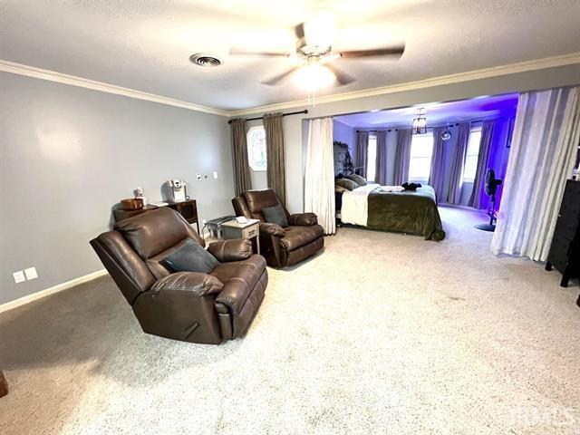 101 Hendron Hills Dr, Vincennes, IN 47591 - carpeted bedroom featuring crown molding, baseboards, and a ceiling fan