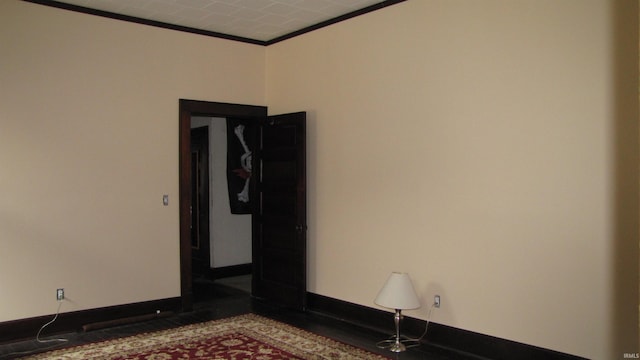 215 S Main St, Oakland City, IN 47660 - spare room featuring ornamental molding and baseboards