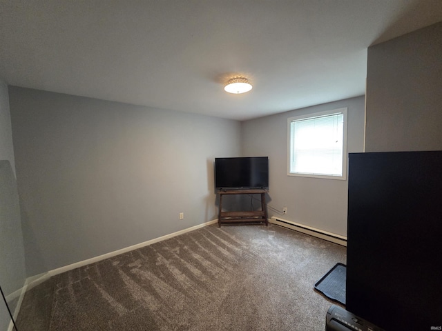 7823 Knightswood Dr, Fort Wayne, IN 46819 - unfurnished living room featuring baseboard heating, dark carpet, and baseboards