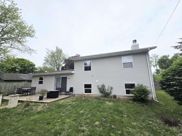 7823 Knightswood Dr, Fort Wayne, IN 46819 - rear view of property featuring a chimney and a lawn
