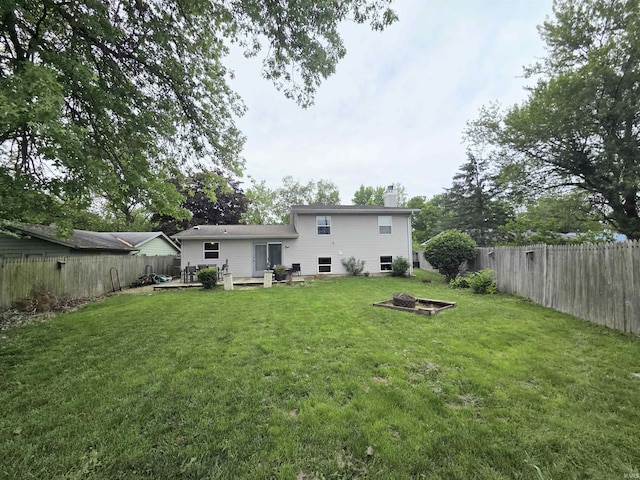 7823 Knightswood Dr, Fort Wayne, IN 46819 - rear view of property featuring a chimney, a deck, and a fire pit