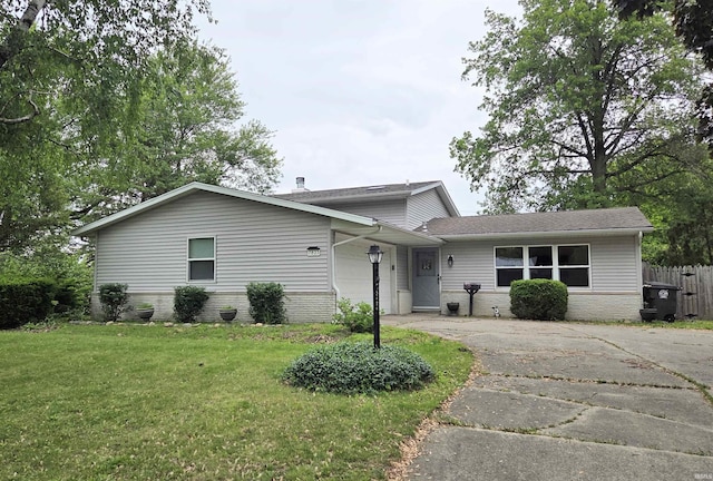7823 Knightswood Dr, Fort Wayne, IN 46819 - view of front facade featuring brick siding, concrete driveway, and a shingled roof