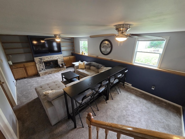 7823 Knightswood Dr, Fort Wayne, IN 46819 - living room featuring ceiling fan, carpet floors, a fireplace, and baseboards