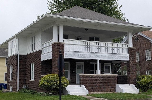 300 E Taylor St, Kokomo, IN 46901 - view of front facade with a balcony, brick siding, a porch, and a shingled roof