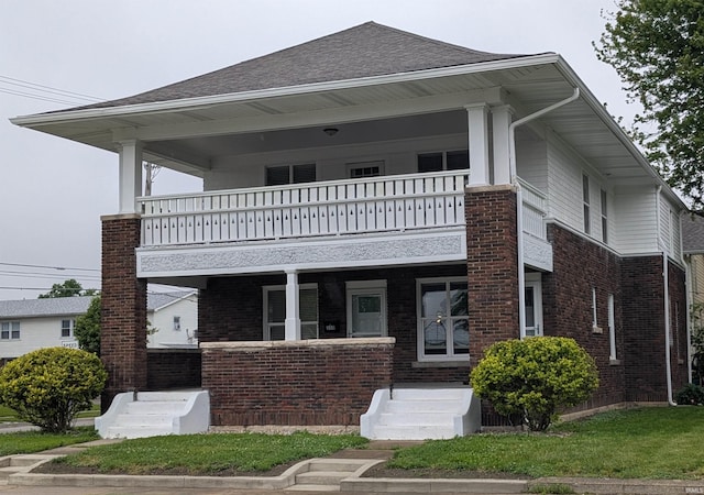 300 E Taylor St, Kokomo, IN 46901 - view of front of home with a balcony, brick siding, covered porch, and roof with shingles