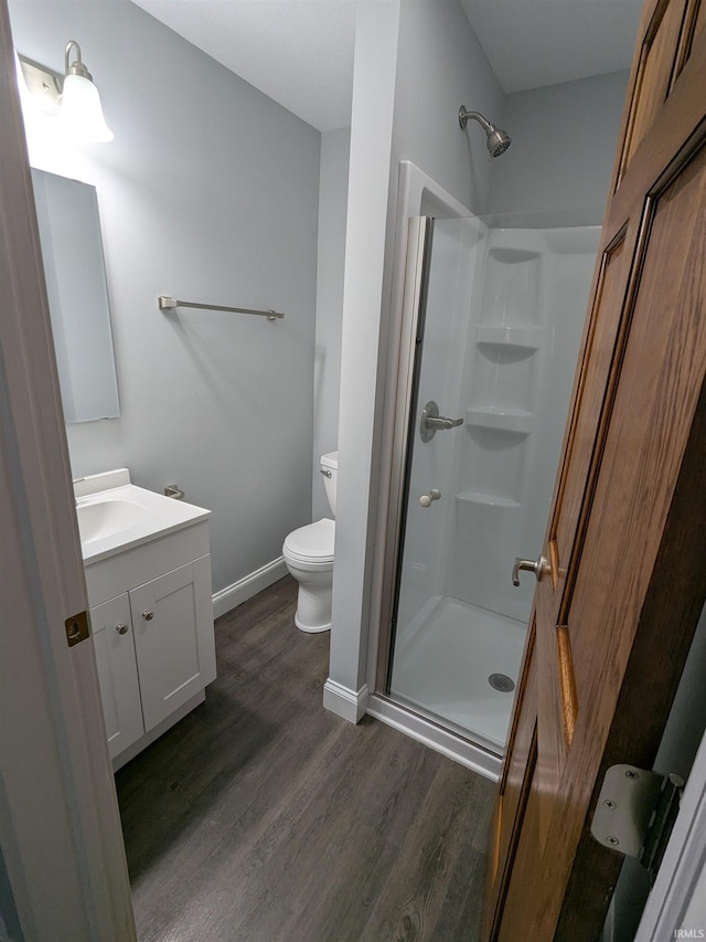 300 E Taylor St, Kokomo, IN 46901 - bathroom with wood finished floors, vanity, a shower stall, toilet, and baseboards