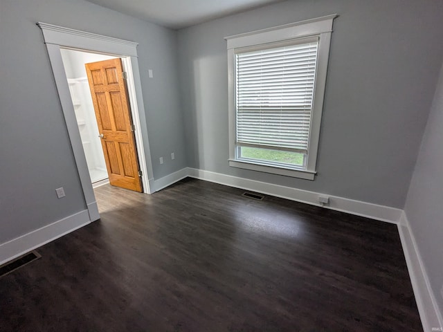 300 E Taylor St, Kokomo, IN 46901 - empty room with dark wood-style flooring and baseboards