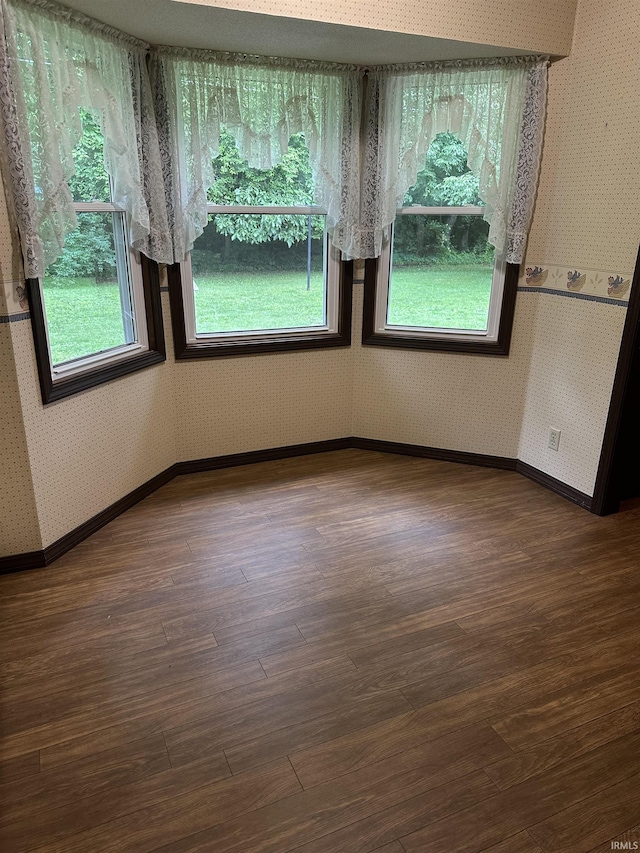 1913 Mckibben St, Wabash, IN 46992 - unfurnished dining area with wallpapered walls and wood finished floors