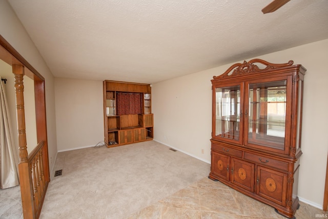 910 S Southland Dr, Lafayette, IN 47909 - spare room featuring light colored carpet, baseboards, and a textured ceiling