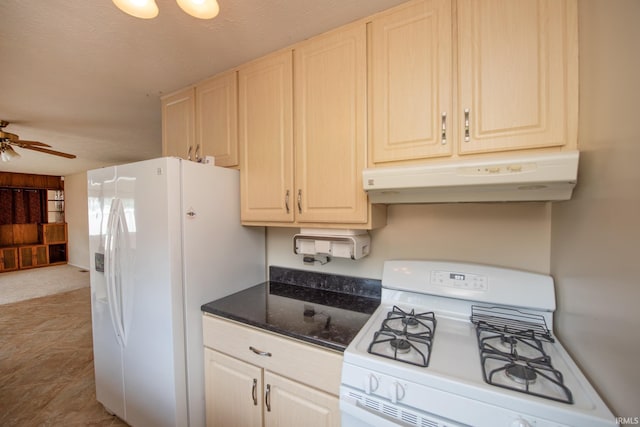 910 S Southland Dr, Lafayette, IN 47909 - kitchen featuring white appliances, under cabinet range hood, ceiling fan, and dark stone counters