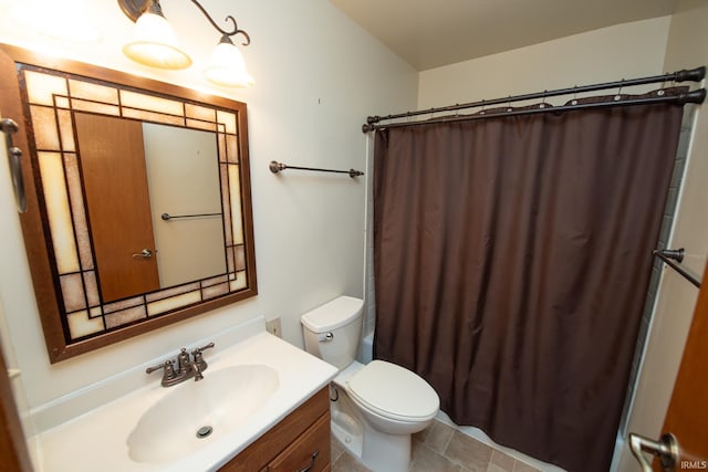 910 S Southland Dr, Lafayette, IN 47909 - full bathroom featuring toilet, vanity, a shower with curtain, and tile patterned flooring