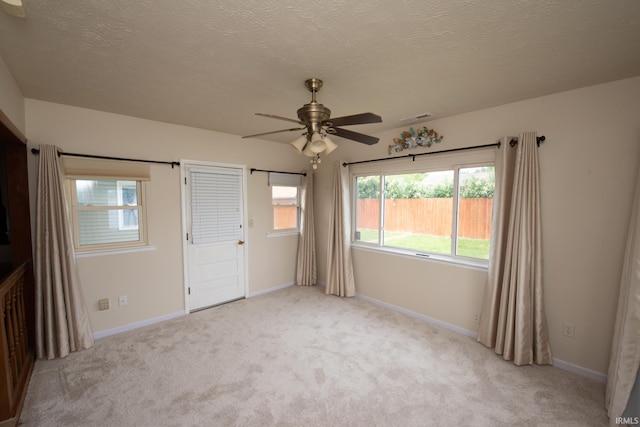 910 S Southland Dr, Lafayette, IN 47909 - spare room with ceiling fan, light carpet, baseboards, and a textured ceiling