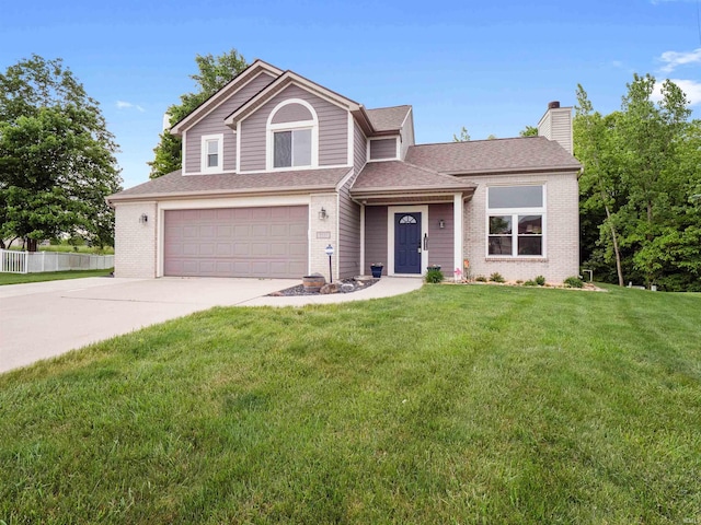 3335 Firethorne Ct, Fort Wayne, IN 46814 - view of front of house with a garage, a chimney, concrete driveway, brick siding, and roof with shingles
