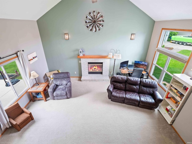 3335 Firethorne Ct, Fort Wayne, IN 46814 - carpeted living room featuring vaulted ceiling, a fireplace, and baseboards