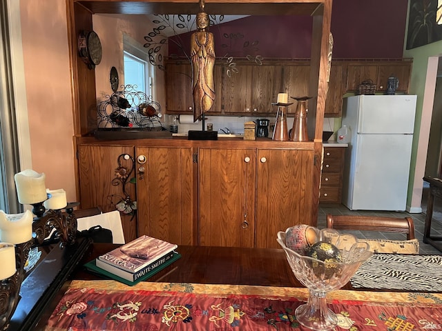504 S Stratton Way, Decatur, IN 46733 - kitchen featuring freestanding refrigerator and brown cabinets