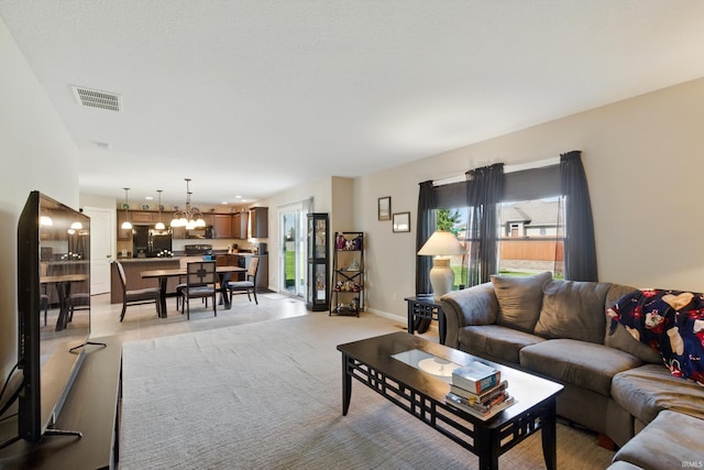 4679 Legacy Cv, Woodburn, IN 46797 - living area featuring a chandelier and baseboards
