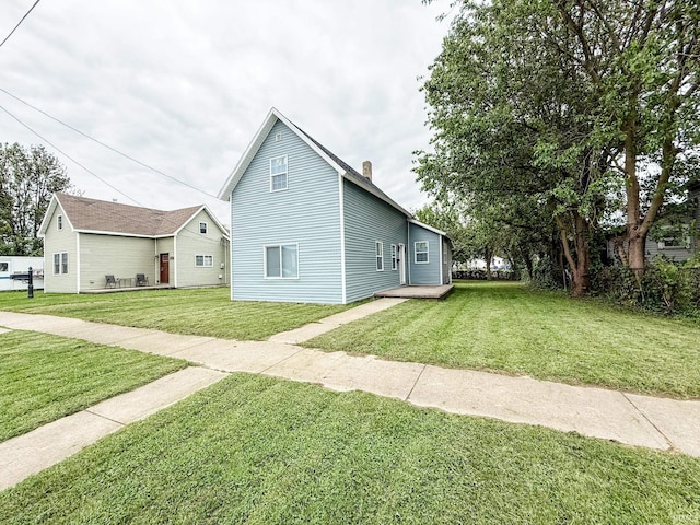 1226 N Union St, Kokomo, IN 46901 - view of property exterior featuring a yard and a chimney