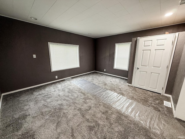 1226 N Union St, Kokomo, IN 46901 - unfurnished bedroom with carpet flooring, multiple windows, and baseboards