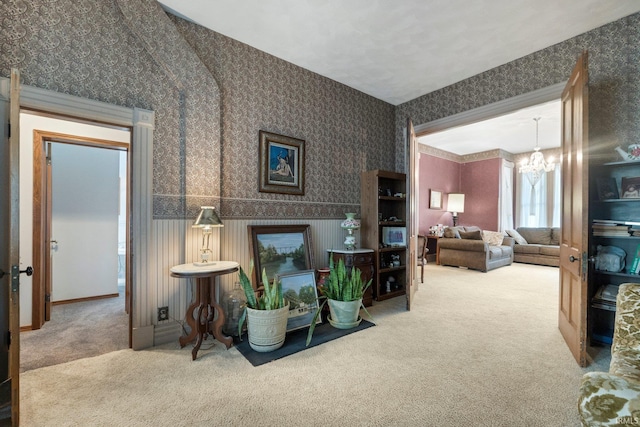 111 N State St, South Whitley, IN 46787 - living room with wallpapered walls, carpet flooring, and a chandelier