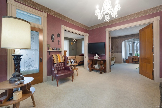 111 N State St, South Whitley, IN 46787 - living area featuring a chandelier, wallpapered walls, and carpet