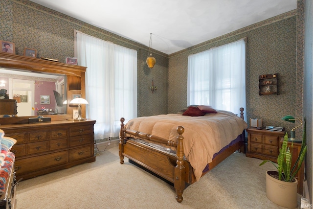 111 N State St, South Whitley, IN 46787 - bedroom with wallpapered walls and light carpet