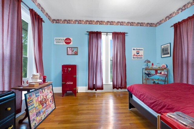 111 N State St, South Whitley, IN 46787 - bedroom with light wood-style flooring and baseboards