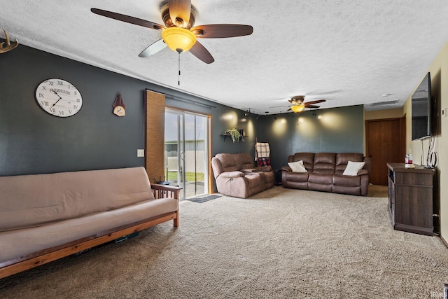 29900 Grant Rd, New Carlisle, IN 46552 - living area featuring ceiling fan, a textured ceiling, and carpet flooring