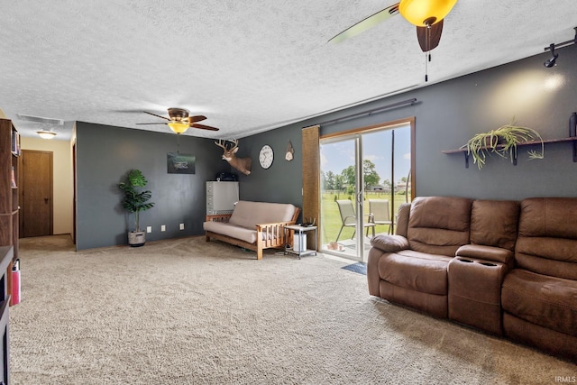 29900 Grant Rd, New Carlisle, IN 46552 - carpeted living area with ceiling fan and a textured ceiling