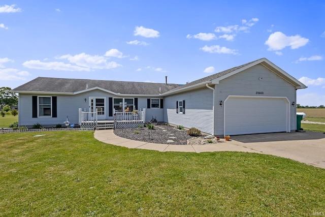 29900 Grant Rd, New Carlisle, IN 46552 - single story home featuring a porch, a garage, concrete driveway, a front yard, and a shingled roof