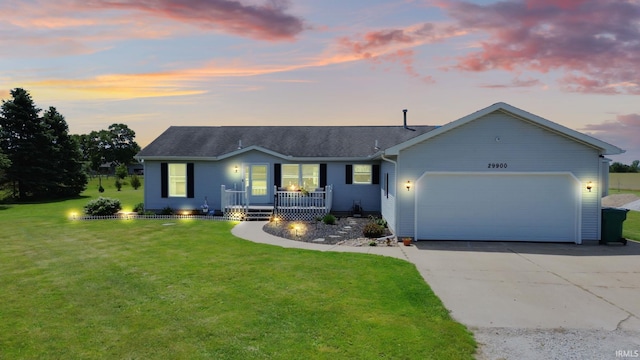29900 Grant Rd, New Carlisle, IN 46552 - single story home with a porch, a garage, driveway, a lawn, and a shingled roof
