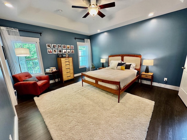 855 N Abigail Ln, Ellettsville, IN 47429 - bedroom with baseboards, dark wood-style flooring, a raised ceiling, recessed lighting, and a ceiling fan