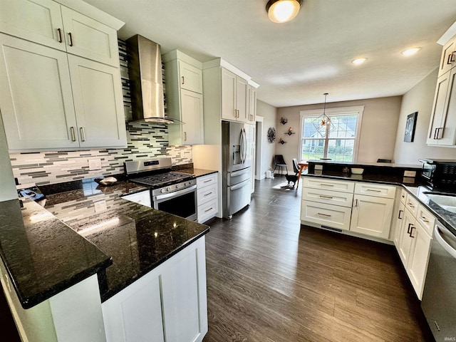855 N Abigail Ln, Ellettsville, IN 47429 - kitchen with stainless steel appliances, a peninsula, wall chimney exhaust hood, dark wood-style floors, and recessed lighting