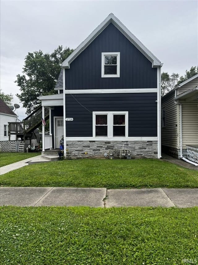 2728 W Virginia Ave, Evansville, IN 47712 - view of front of home featuring stone siding and a front lawn