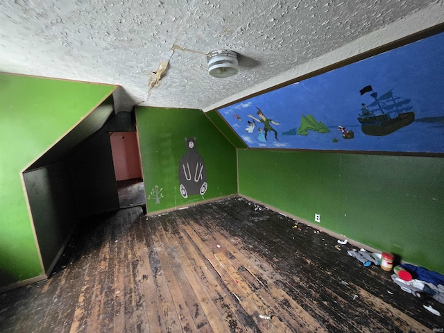 2710 W Virginia St, Evansville, IN 47712 - additional living space featuring hardwood / wood-style floors, lofted ceiling, a textured ceiling, and baseboards