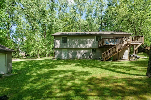 51410 Mansfield Dr, South Bend, IN 46628 - back of property featuring stairs, a wooden deck, and a lawn