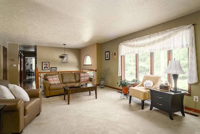 51410 Mansfield Dr, South Bend, IN 46628 - living area featuring a textured ceiling, light carpet, and baseboards