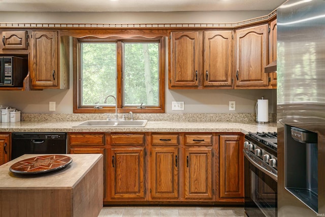 51410 Mansfield Dr, South Bend, IN 46628 - kitchen featuring black appliances, a sink, range hood, and brown cabinetry