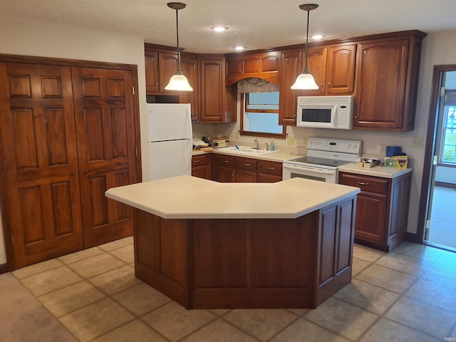 5454 Ski Dr, Loogootee, IN 47553 - kitchen with white appliances, a sink, light countertops, a center island, and recessed lighting