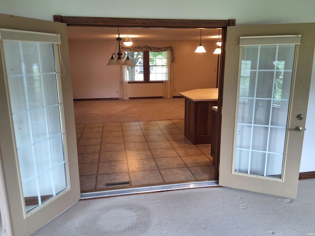 5454 Ski Dr, Loogootee, IN 47553 - unfurnished dining area with light carpet and baseboards