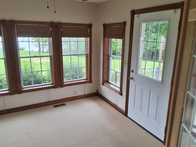 5454 Ski Dr, Loogootee, IN 47553 - entryway with light carpet, plenty of natural light, a ceiling fan, and baseboards
