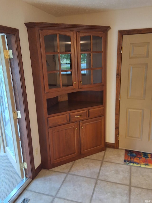 5454 Ski Dr, Loogootee, IN 47553 - unfurnished dining area with light tile patterned flooring and baseboards