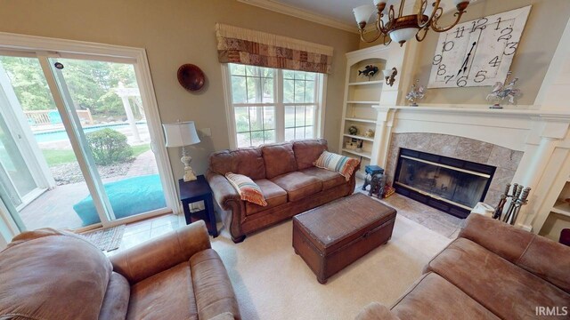 3043 N 400 E Xrd, Monticello, IN 47960 - living room featuring a fireplace, built in shelves, crown molding, and a chandelier