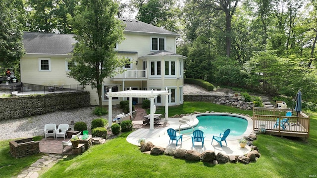 3043 N 400 E Xrd, Monticello, IN 47960 - back of house with a deck, a yard, an outdoor pool, a patio, and a pergola