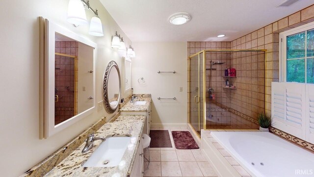 3043 N 400 E Xrd, Monticello, IN 47960 - full bath with a stall shower, vanity, a garden tub, and tile patterned flooring