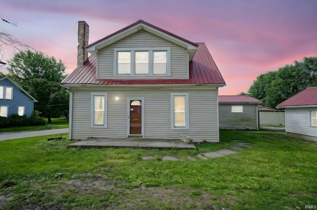 6814 Church St, Lafayette, IN 47905 - bungalow-style home featuring a front yard, metal roof, a patio area, and a chimney