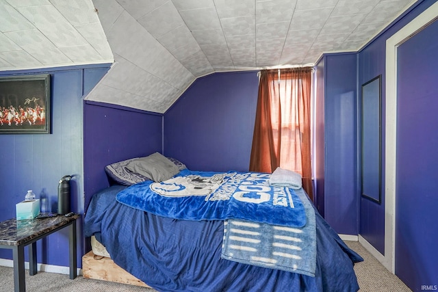 6814 Church St, Lafayette, IN 47905 - carpeted bedroom featuring vaulted ceiling, wooden walls, and baseboards