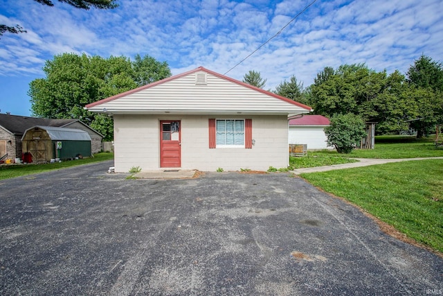 6814 Church St, Lafayette, IN 47905 - view of front of house with a front lawn and concrete block siding