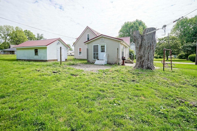6814 Church St, Lafayette, IN 47905 - rear view of property featuring entry steps and a lawn