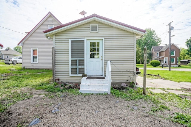 6814 Church St, Lafayette, IN 47905 - rear view of house featuring a yard