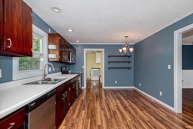 650 E Spear Rd, Columbia City, IN 46725 - kitchen with appliances with stainless steel finishes, a sink, light countertops, dark wood-style flooring, and a textured ceiling